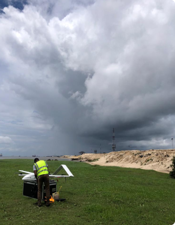 A man with a drone in a field