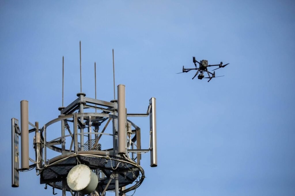 A drone flying near a cell phone tower