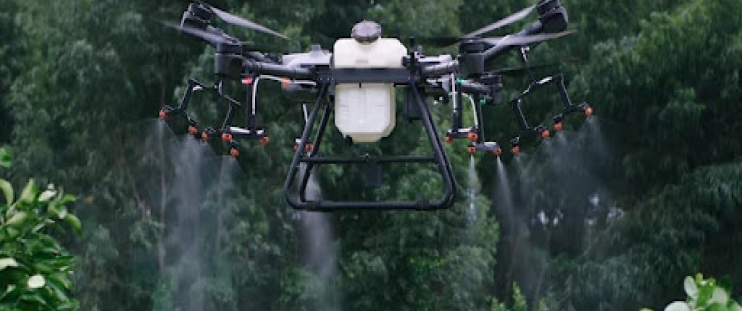 An agricultural drone spraying crops in a field