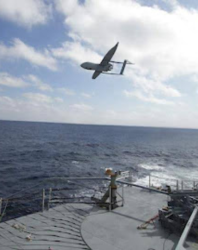 A drone flying over an ocean