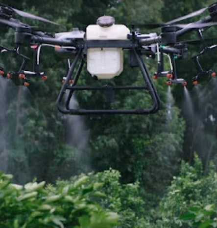 An agricultural drone spraying crops in a field