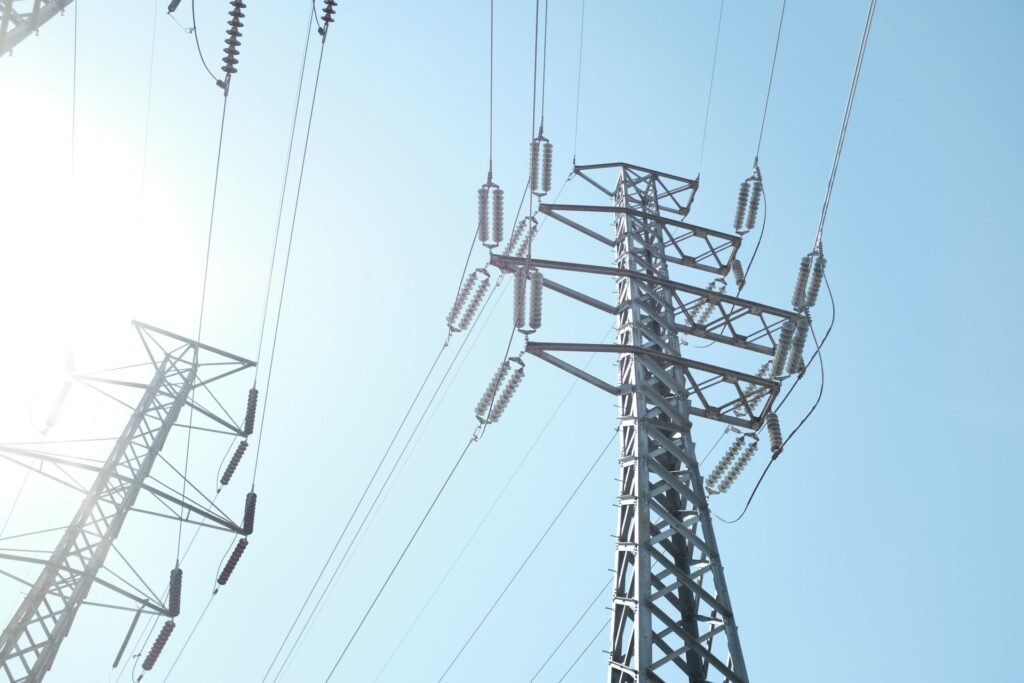 Close-up of high-voltage power lines on a trasnmission tower